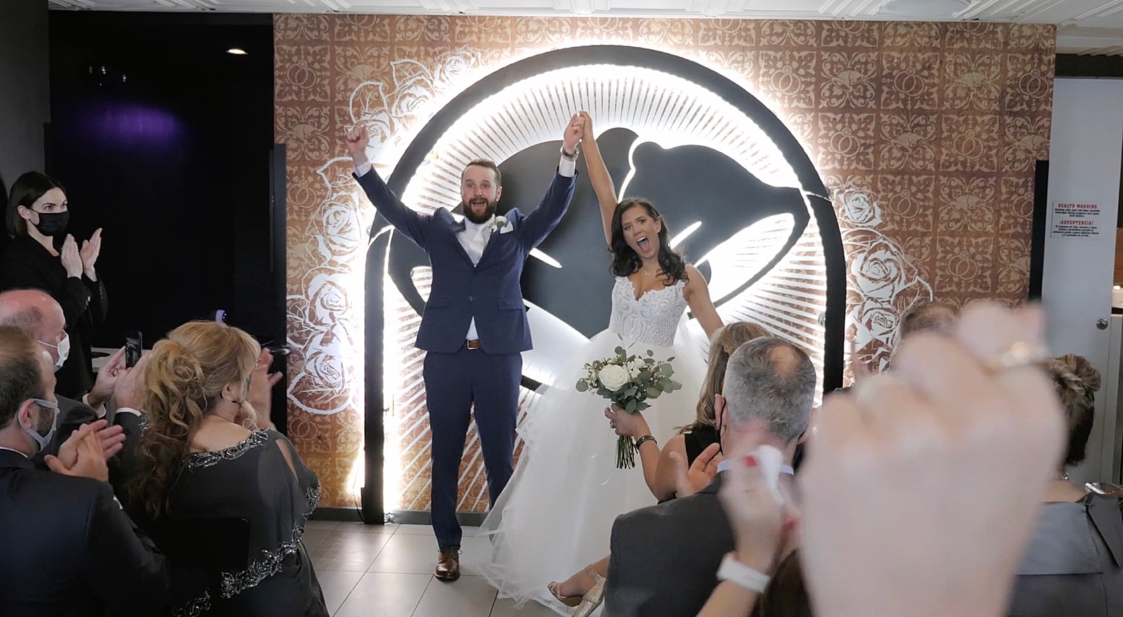 Bride and groom celebrating after they said I Do at their Las Vegas Taco Bell wedding 